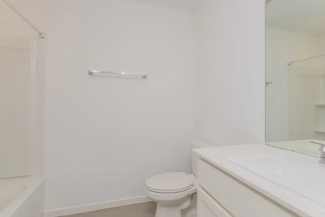 a bathroom with a toilet and a sink