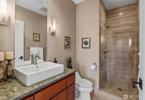 a bathroom with a sink toilet and shower