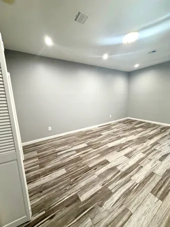 a view of room and wooden floor