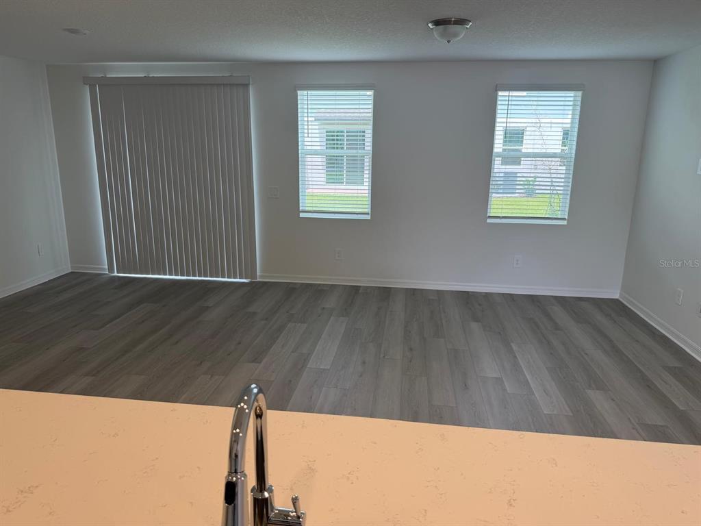 4264 Ranch House Road St. Cloud, FL 34772 - Photo 6 of 34 a view of wooden floor