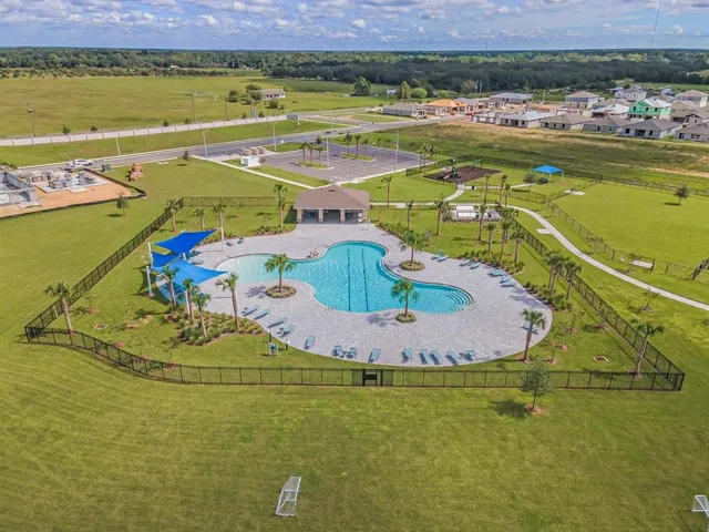 a view of a swimming pool and an outdoor space