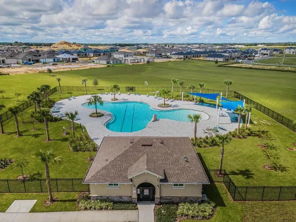 an aerial view of a house with a ocean view