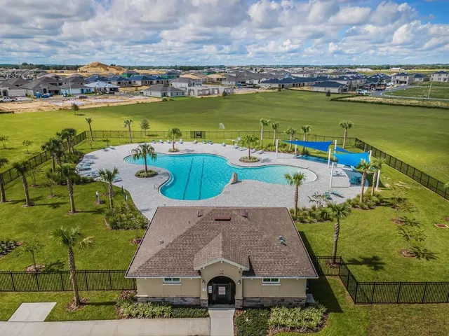 an aerial view of a house with a ocean view