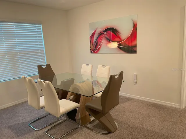 a view of a dining room with furniture