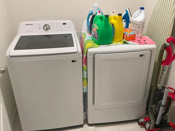 a utility room with dryer and washer