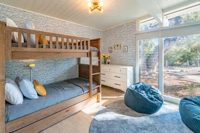 a stove top oven sitting inside of a kitchen