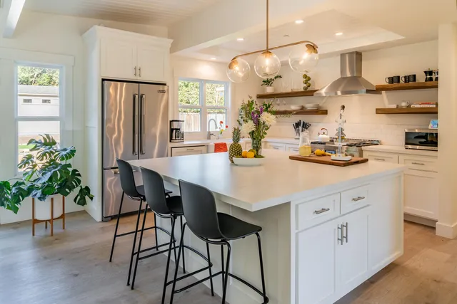 a bedroom with a bed and a lamp