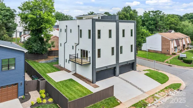 a view of a house with pool and a yard