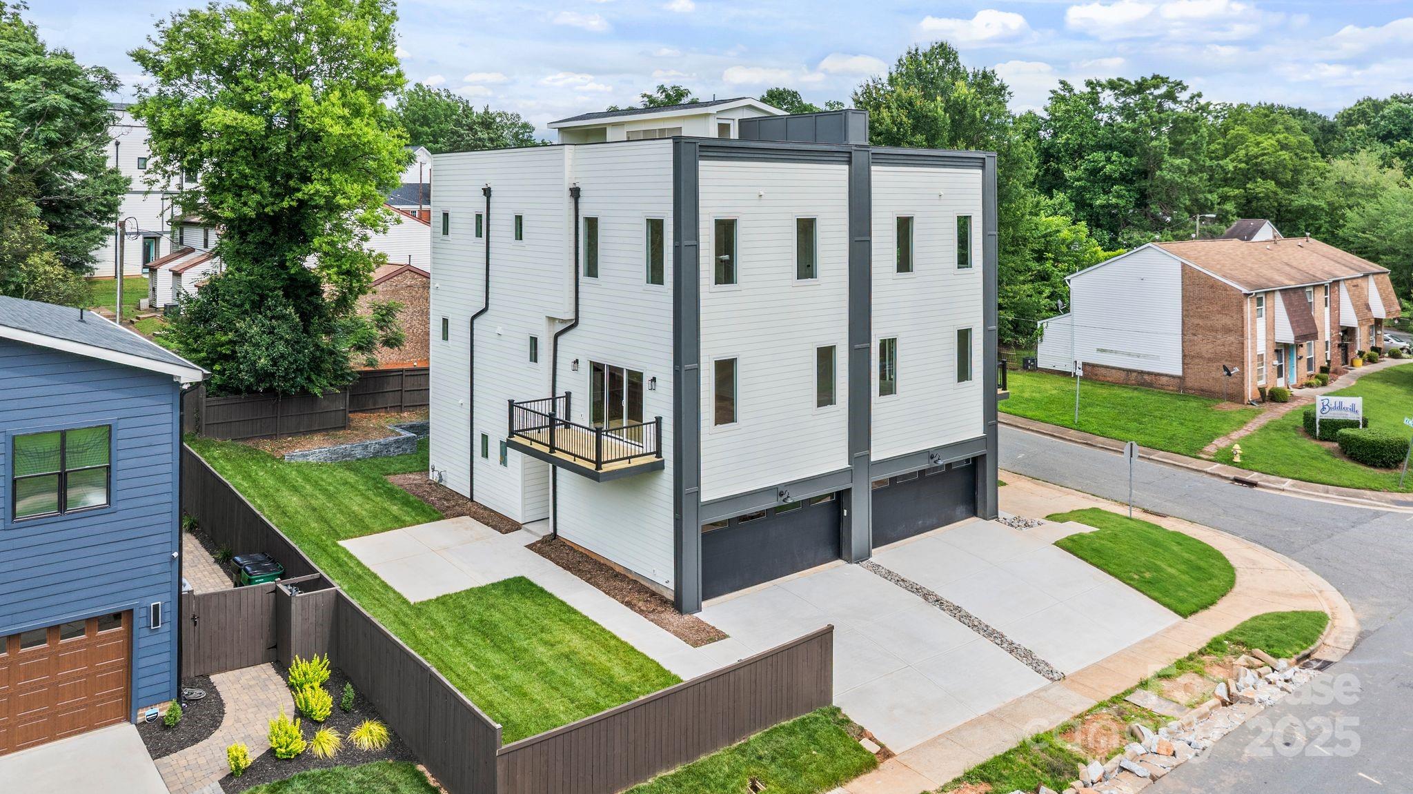 a view of a house with pool and a yard