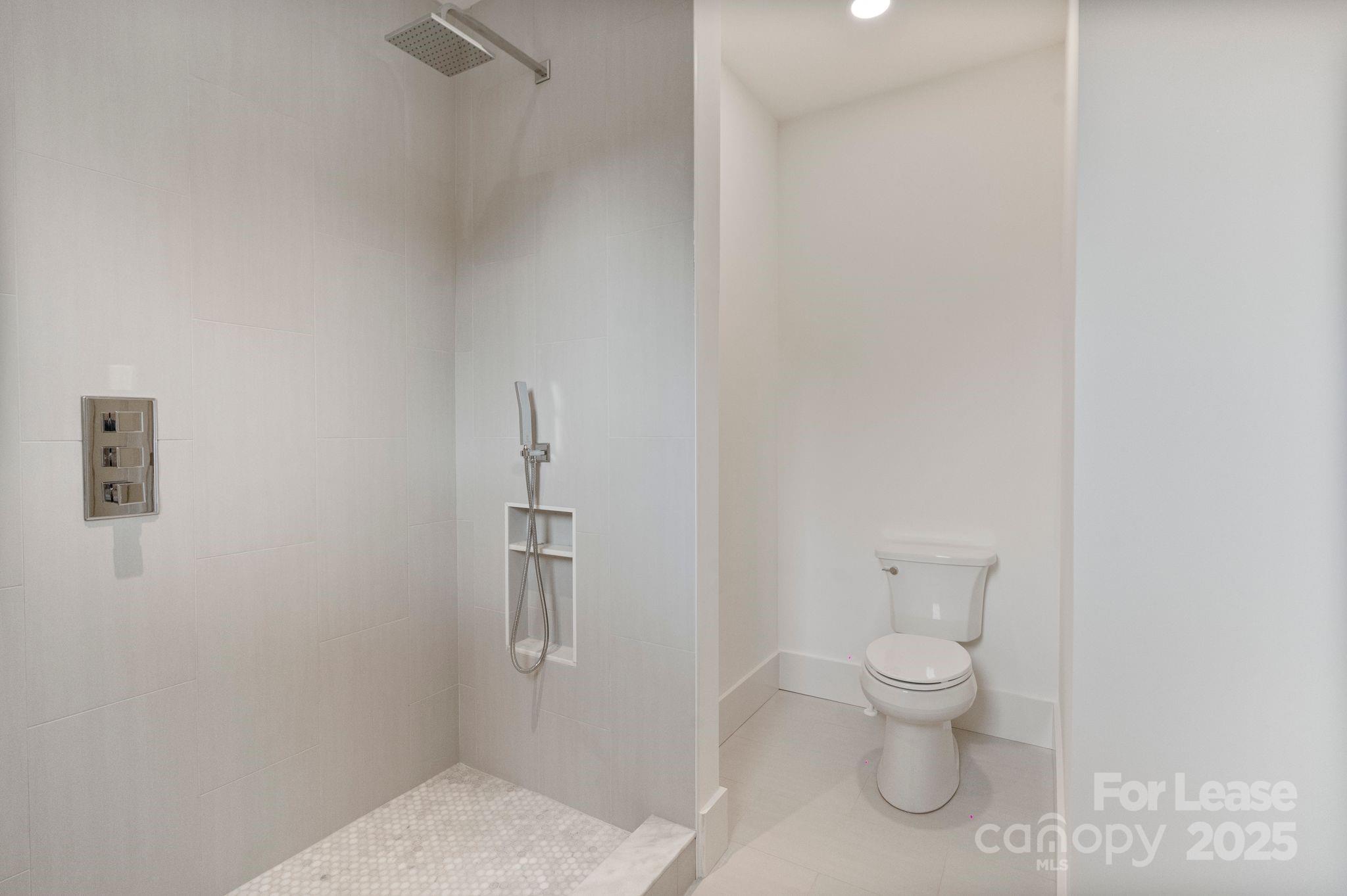 129 French Street, Unit B Charlotte, NC 28216 - Photo 19 of 32 a bathroom with a toilet