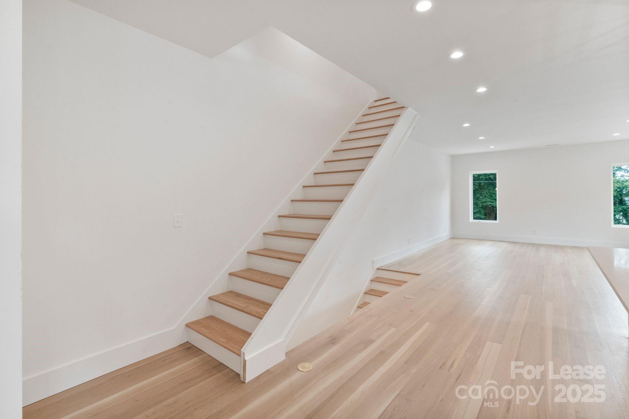 129 French Street, Unit B Charlotte, NC 28216 - Photo 8 of 32 a view of an entryway with wooden floor