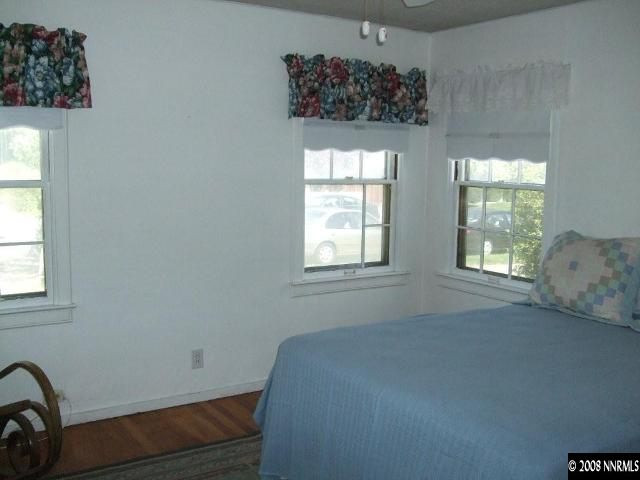 760 Walker Avenue Reno, NV 89509 - Photo 4 of 9 a bed sitting in a bedroom next to a window