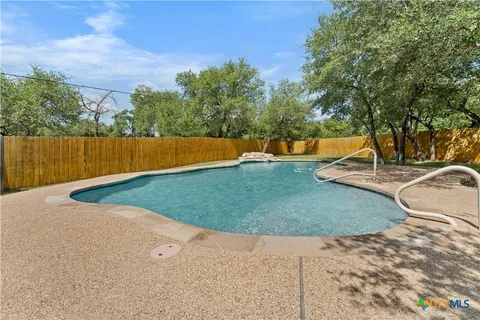 a view of a backyard with trees
