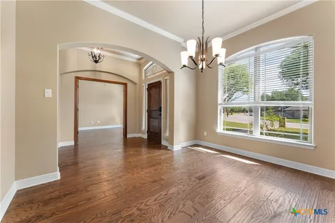 a view of livingroom with window and hardwood floor