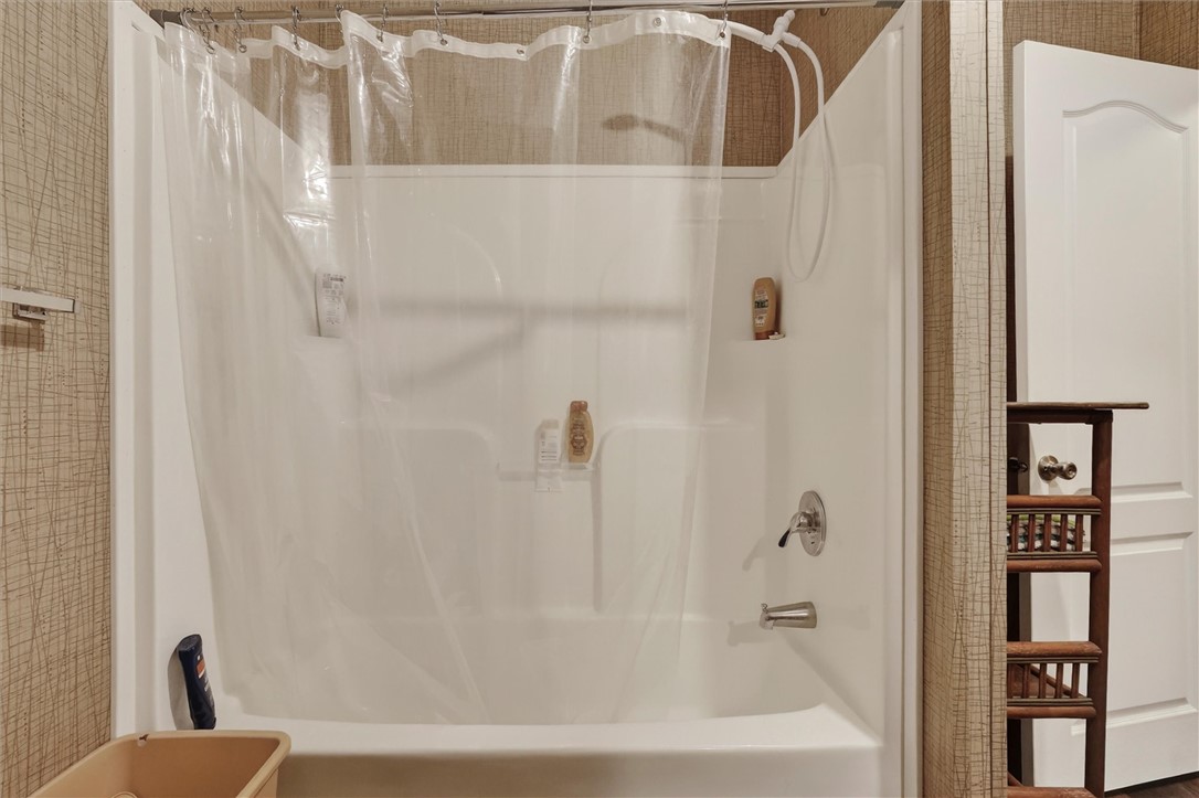 1926 Fairview Road Peebles, OH 45660 - Photo 32 of 44 This bathroom features a functional bathtub with a shower.