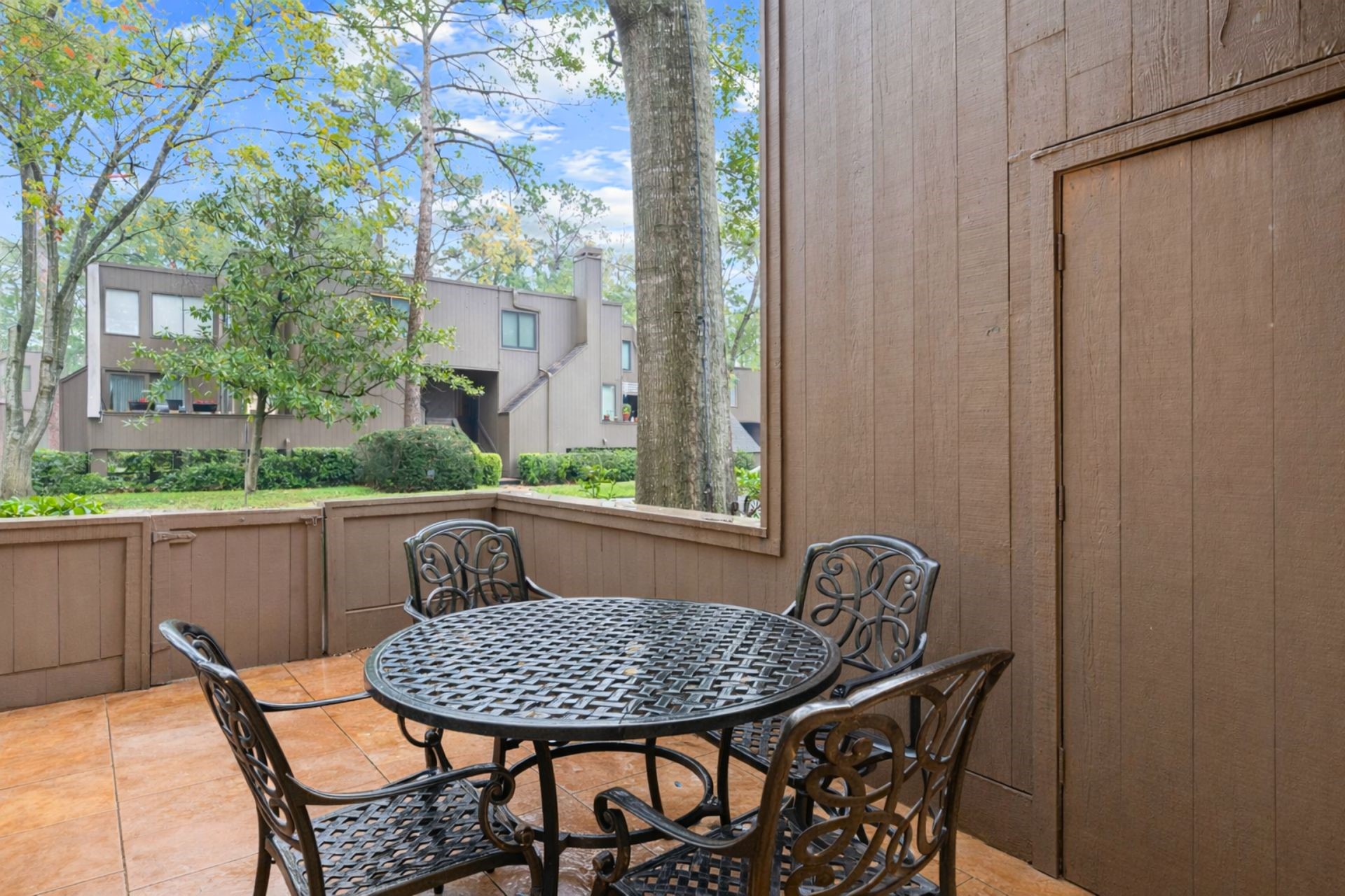 172 Litchfield Lane Houston, TX 77024 - Photo 14 of 16 a view of balcony with a table and chairs
