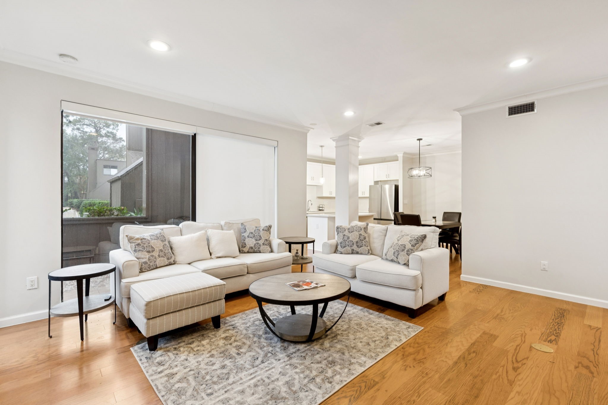 172 Litchfield Lane Houston, TX 77024 - Photo 3 of 16 a living room with furniture and a large window