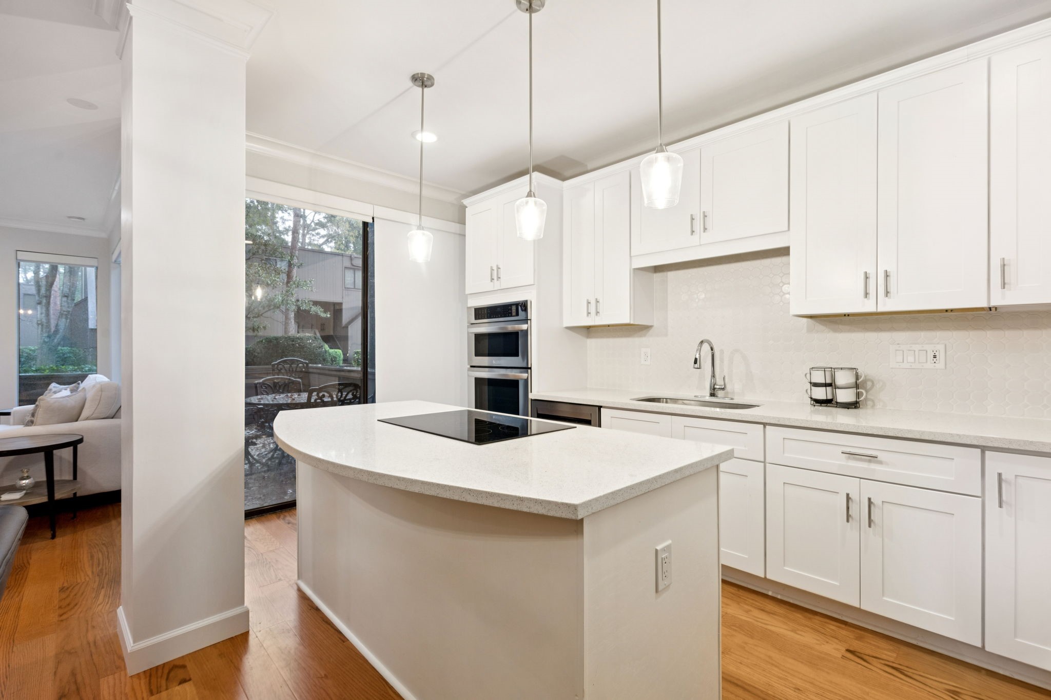 172 Litchfield Lane Houston, TX 77024 - Photo 6 of 16 a kitchen filled with white cabinets and white appliances