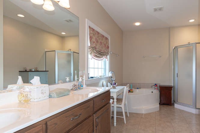 1997 Clara Mathis Road Spring Hill, TN 37174 - Photo 22 of 47 a bathroom with a double vanity sink and a mirror