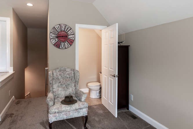 1997 Clara Mathis Road Spring Hill, TN 37174 - Photo 26 of 47 a bathroom with a toilet and a shower curtain