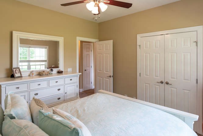 1997 Clara Mathis Road Spring Hill, TN 37174 - Photo 30 of 47 a bedroom with a bed and a mirror on dresser