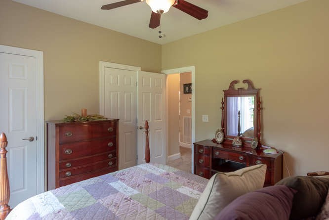 1997 Clara Mathis Road Spring Hill, TN 37174 - Photo 33 of 47 a bedroom with a bed and a dresser