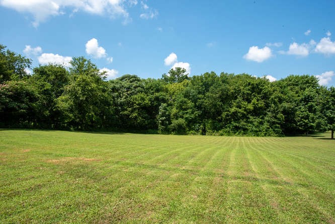 1997 Clara Mathis Road Spring Hill, TN 37174 - Photo 40 of 47 a view of a field of grass and a yard