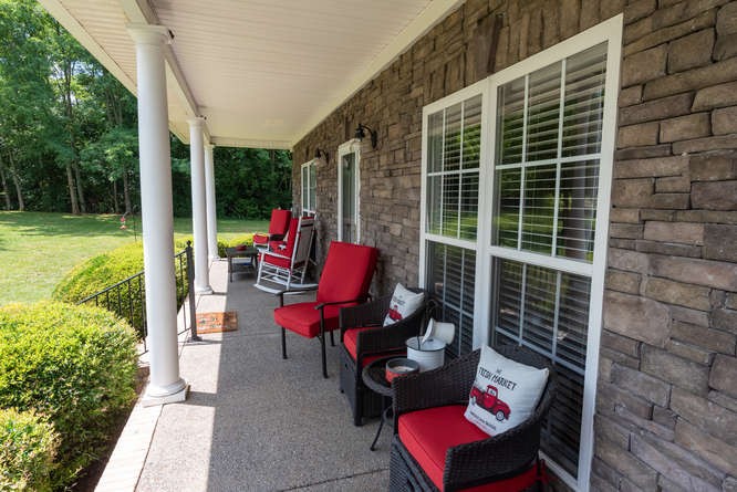 1997 Clara Mathis Road Spring Hill, TN 37174 - Photo 5 of 47 a view of a patio with couches chairs and potted plants