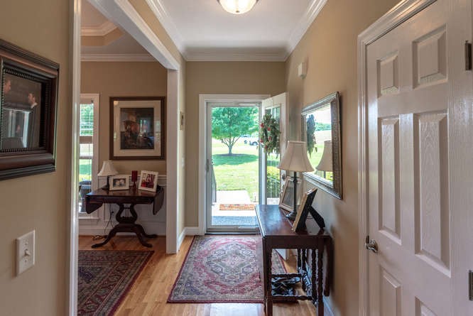 1997 Clara Mathis Road Spring Hill, TN 37174 - Photo 7 of 47 a view of a hallway with wooden floor and a livingroom