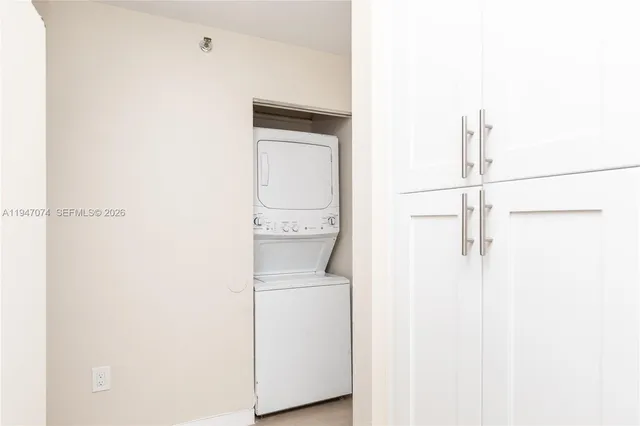 a kitchen with a sink and a stove top oven