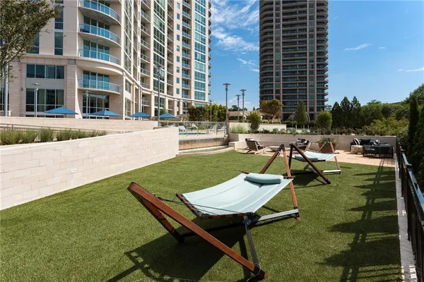 a view of a patio with a table and chairs
