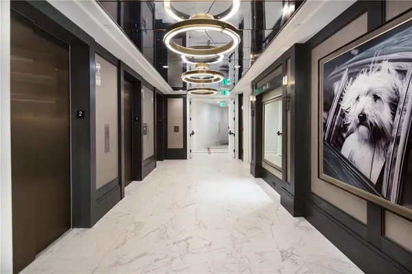 a view of a hallway with a chandelier