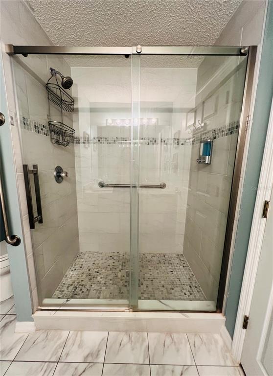 8 Firethorn Lane Palm Coast, FL 32137 - Photo 19 of 28 a bathroom with a shower