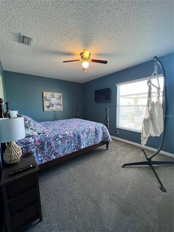 8 Firethorn Lane Palm Coast, FL 32137 - Photo 20 of 28 a bedroom with bed and window