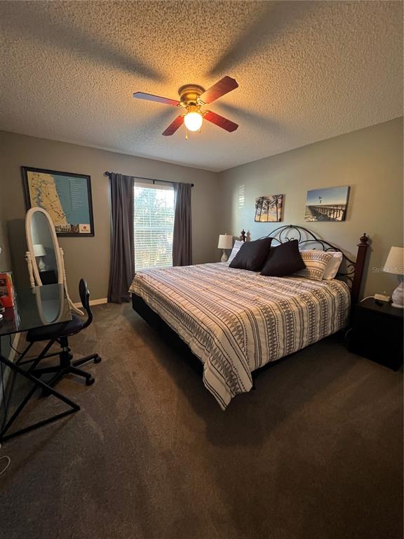 8 Firethorn Lane Palm Coast, FL 32137 - Photo 24 of 28 a bedroom with a bed chair and window
