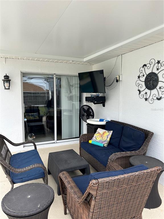 8 Firethorn Lane Palm Coast, FL 32137 - Photo 25 of 28 a living room with furniture and a rug