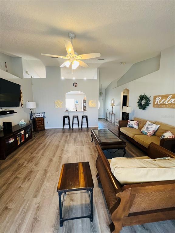 8 Firethorn Lane Palm Coast, FL 32137 - Photo 6 of 28 a living room with furniture and a flat screen tv