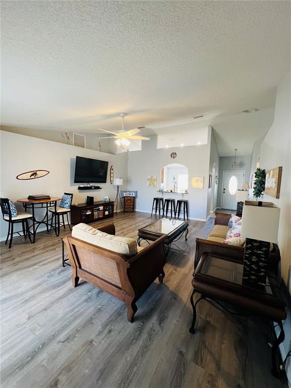 8 Firethorn Lane Palm Coast, FL 32137 - Photo 7 of 28 a living room with furniture and a flat screen tv