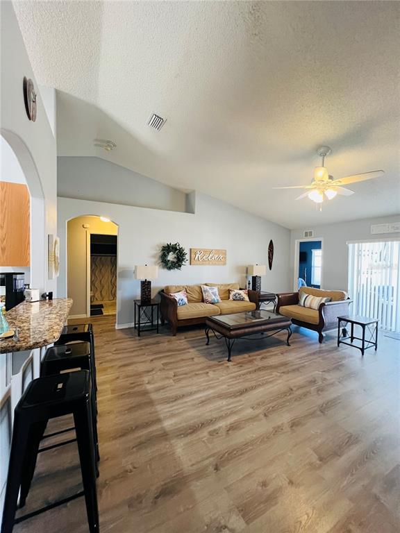 8 Firethorn Lane Palm Coast, FL 32137 - Photo 8 of 28 a living room with furniture and a large window