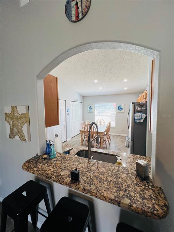 8 Firethorn Lane Palm Coast, FL 32137 - Photo 9 of 28 a kitchen with a table and chairs in it