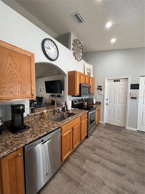 8 Firethorn Lane Palm Coast, FL 32137 - Photo 10 of 28 a large kitchen with stainless steel appliances granite countertop a stove and a sink