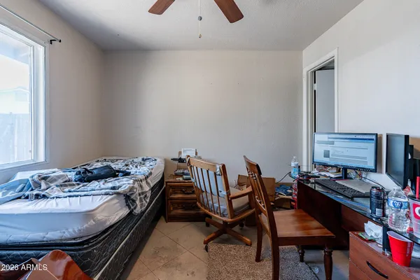 a bedroom with furniture and a window