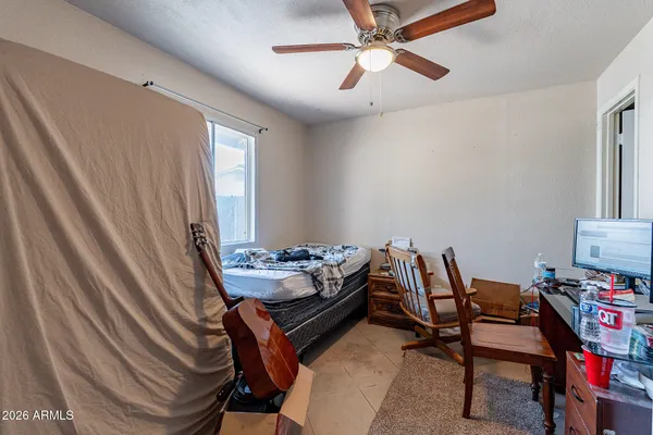a view of a patio with table and chairs