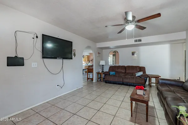 a view of backyard with cabin and a wooden fence