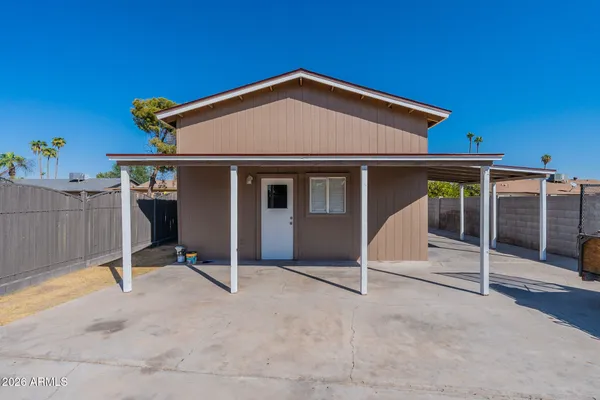 a kitchen with stainless steel appliances granite countertop a refrigerator a sink a stove and island