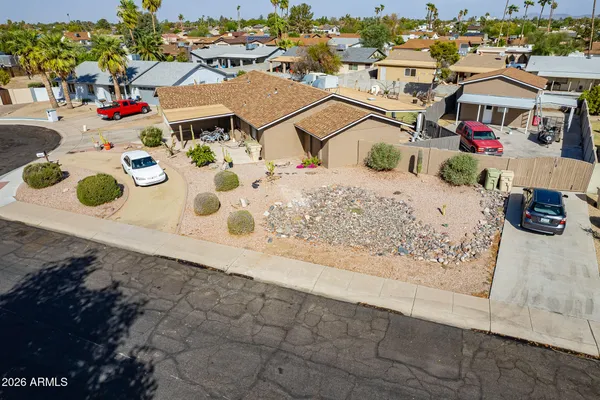 an aerial view of residential houses with outdoor space