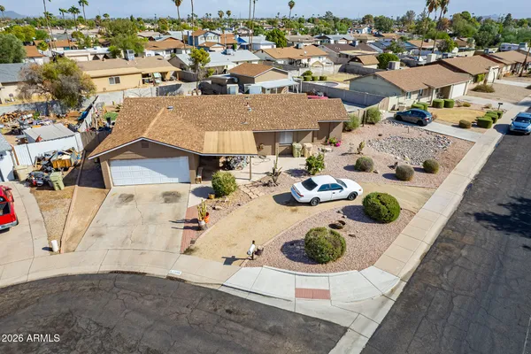 a front view of a house with a big yard