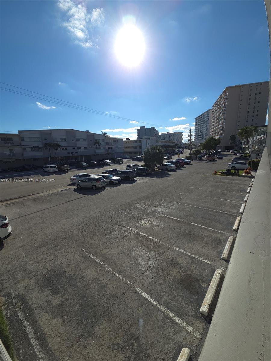 467 Golden Isles Drive, Unit 110 Hallandale Beach, FL 33009 - Photo 6 of 11 a view of a projector screen and a projector screen