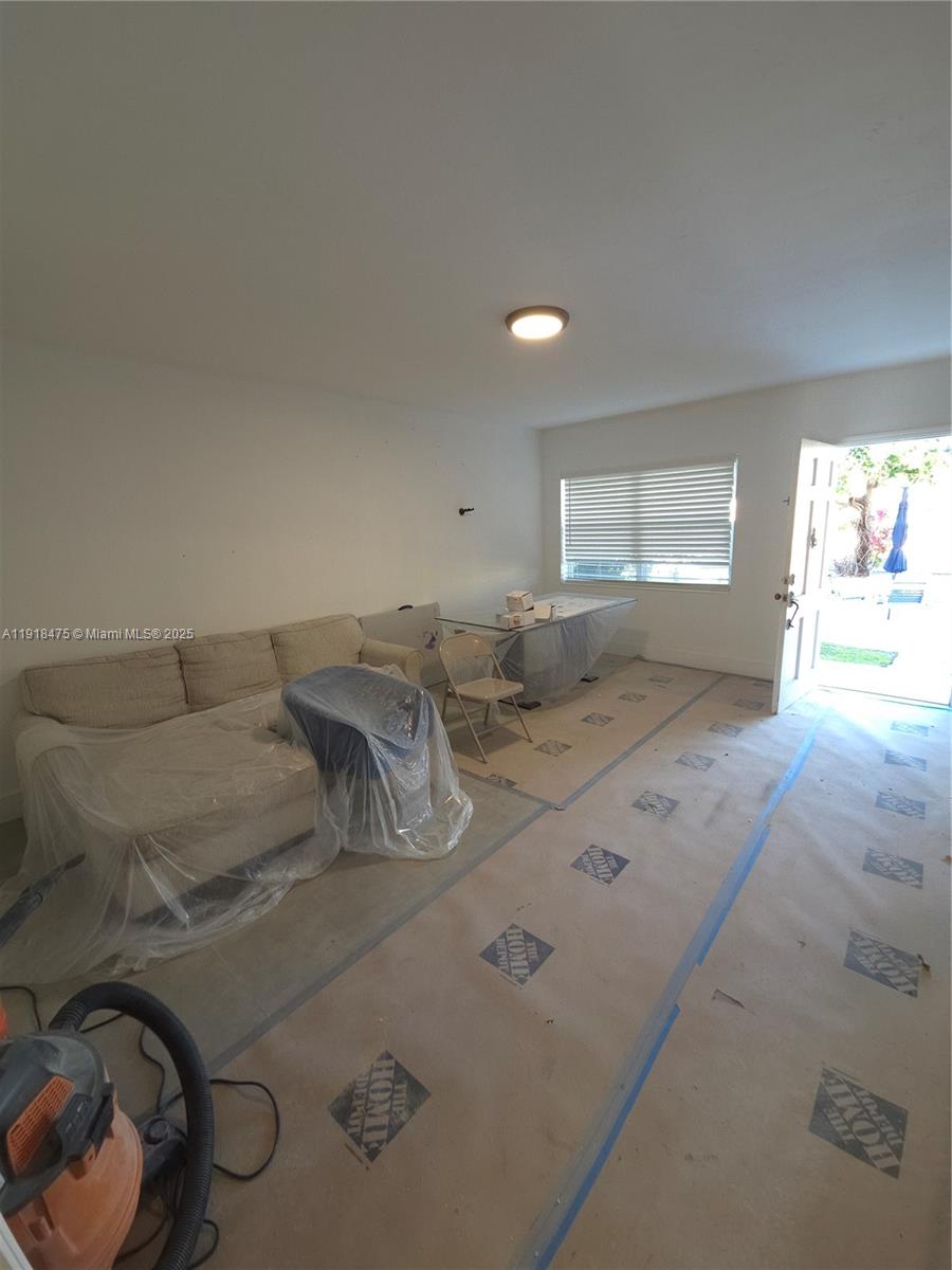467 Golden Isles Drive, Unit 110 Hallandale Beach, FL 33009 - Photo 8 of 11 a view of kitchen and window