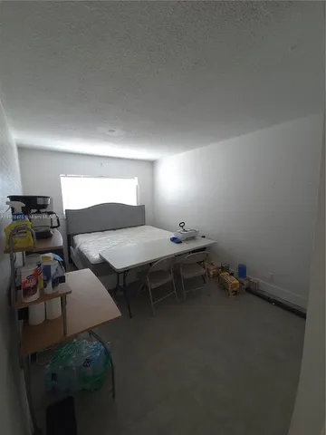 a room with furniture and gym equipment